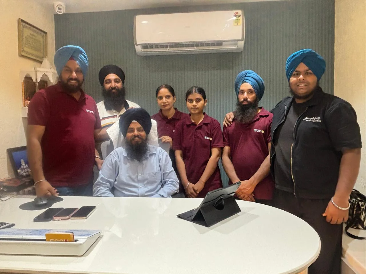 Sonu Arts team with client during signage project discussion